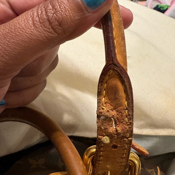 Pampered pre-owned Louis Vuitton Satchel.  Original lining can & a nicked strap.